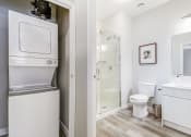 Thumbnail 28 of 28 - Stacked washer/dryer and bathroom with walk in shower at 101 Base Line Road West, London, Ontario