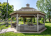 Thumbnail 2 of 10 - a white gazebo in a park