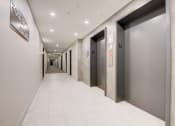 Thumbnail 6 of 11 - a row of elevators in an office building