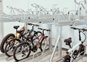 Thumbnail 12 of 37 - A bike rack with several bikes parked on it.