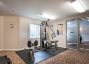 Thumbnail 1 of 23 - a fitness center with a treadmills and other exercise equipment