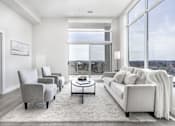 Thumbnail 18 of 37 - A modern living room with a view of the city.