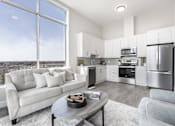 Thumbnail 14 of 37 - A modern kitchen with a view of the city.
