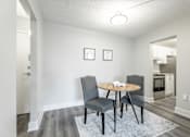 Thumbnail 10 of 15 - A dining room with a round table and chairs  at Platts Crossing, London, ON, N6H 4P4