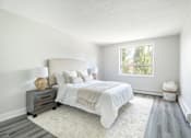 Thumbnail 13 of 15 - A bedroom with a large bed and a window  at Platts Crossing, London, ON, N6H 4P4