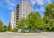 Thumbnail 16 of 23 - an empty street with an apartment building in the background
