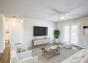 Thumbnail 13 of 43 - a living room filled with furniture and a flat screen tv