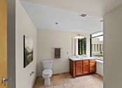 Thumbnail 14 of 43 - a bathroom with a toilet and a sink and a window
