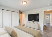 Thumbnail 4 of 43 - a bedroom with a large bed and a flat screen tv