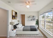 Thumbnail 67 of 67 - a bedroom with a bed and a ceiling fan