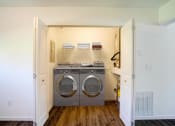 Thumbnail 36 of 43 - a laundry room with a washer and a dryer