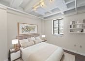 Thumbnail 13 of 43 - a bedroom with a large bed and a window