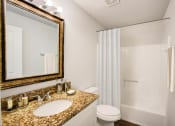 Thumbnail 15 of 43 - a bathroom with a sink toilet and shower