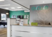 Thumbnail 20 of 42 - a reception area with a desk and a tree etched on the wall