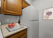 Thumbnail 33 of 48 - a kitchen with a refrigerator and a sink