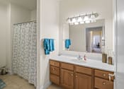 Thumbnail 52 of 67 - a bathroom with a sink and a shower and a toilet