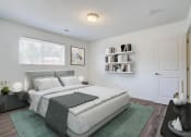 Thumbnail 35 of 43 - a bedroom with a bed and a bookshelf