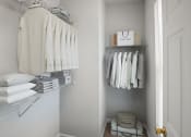 Thumbnail 47 of 48 - a small walk in closet with shelves and rails for clothing and a basket on the floor