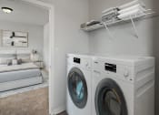 Thumbnail 44 of 48 - a washer and dryer in a laundry room with a bed in the background