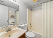 Thumbnail 11 of 48 - a bathroom with a sink toilet and shower