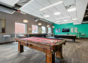 Thumbnail 3 of 42 - a games room with a pool table and ping pong