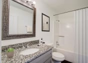 Thumbnail 30 of 43 - a bathroom with a sink and a toilet
