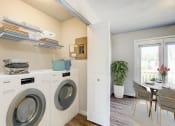 Thumbnail 10 of 43 - a washer and dryer in a laundry room