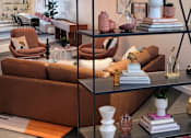 Thumbnail 4 of 10 - a room filled with furniture and a large window