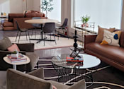 Thumbnail 8 of 10 - a living room filled with furniture and a large window