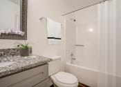 Thumbnail 37 of 43 - a bathroom with a toilet sink and bathtub