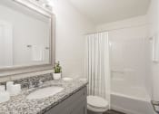 Thumbnail 25 of 43 - a bathroom with a sink toilet and shower