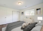 Thumbnail 34 of 43 - a bedroom with a bed and a window
