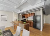 Thumbnail 5 of 43 - an open kitchen and dining area with a black refrigerator