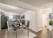 Thumbnail 23 of 43 - a kitchen and dining room with a table and chairs