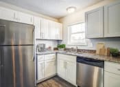 Thumbnail 18 of 43 - a kitchen with a stainless steel refrigerator freezer and dishwasher