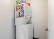Thumbnail 41 of 42 - a washer and dryer in the corner of a room