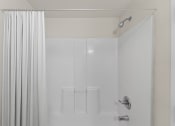 Thumbnail 16 of 43 - a white shower with a shower curtain in a bathroom