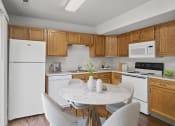 Thumbnail 15 of 48 - a kitchen with white appliances and wooden cabinets