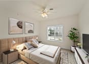 Thumbnail 39 of 67 - a bedroom with a large bed and a ceiling fan