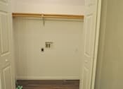 Thumbnail 48 of 51 - A white door with a brown frame is open.