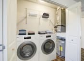 Thumbnail 20 of 43 - a washer and dryer in a laundry room
