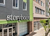 Thumbnail 5 of 56 - The Storyboard storefront is on the corner of a street.