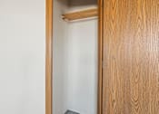 Thumbnail 16 of 64 - A white door is open to a room with a wooden door.