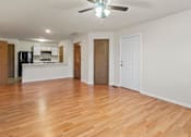 Thumbnail 60 of 64 - A room with wooden floors and a ceiling fan.
