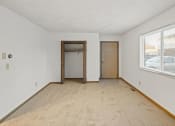 Thumbnail 15 of 26 - an empty room with a large window and a door