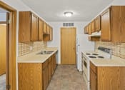 Thumbnail 14 of 26 - a kitchen with a stove and a refrigerator