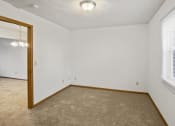 Thumbnail 18 of 26 - an empty room with a window and a mirror