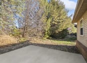 Thumbnail 3 of 15 - a covered patio with trees in the background on a sunny day