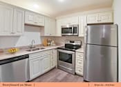 Thumbnail 7 of 31 - a kitchen with stainless steel appliances and white cabinets