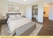 Thumbnail 17 of 31 - a bedroom with a bed and a closet